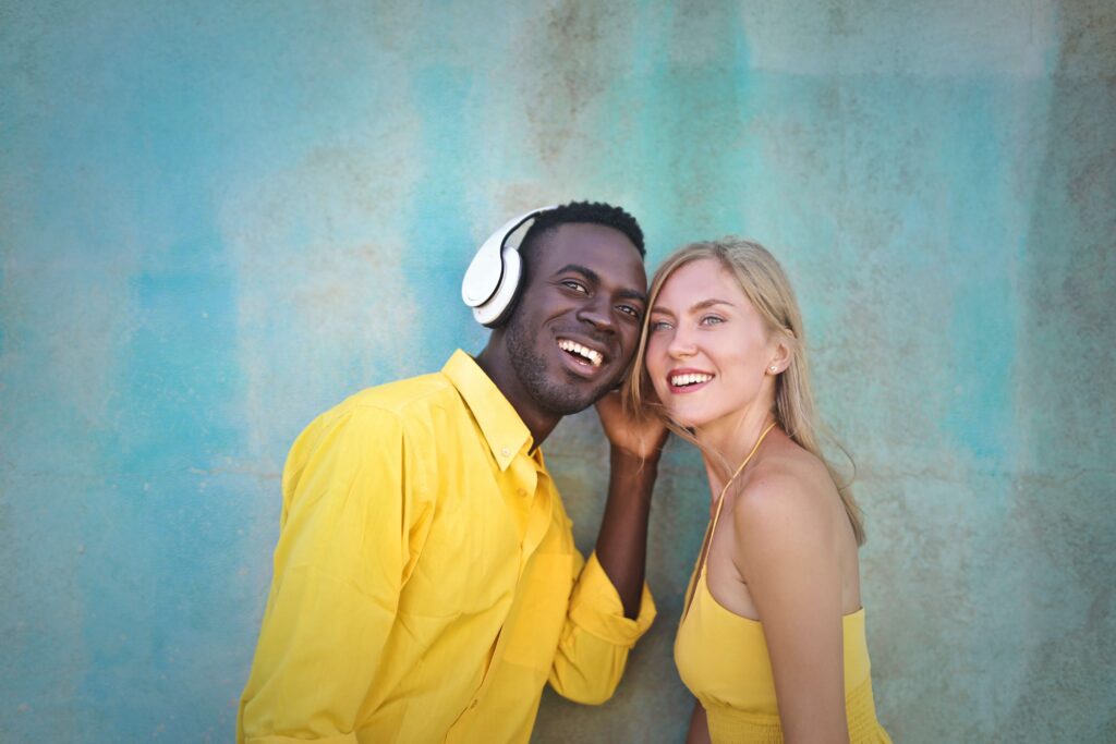 A happy couple listens to music together as they work on reconnecting with the help of a Couples Therapist in Burbank CA. 