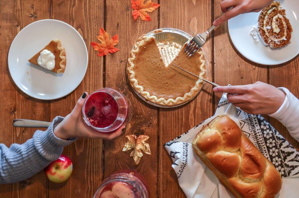 People at a table filled with Thanksgiving Day food representing the anxiety that can come with the holiday season. Learn how to cope with these feelings in Therapy for Anxiety in Burbank, CA.