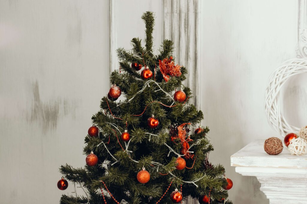 A small Christmas tree with red ornaments representing the anxiety that often comes with the holidays. Learn to cope with the help of an Anxiety Therapist in Burbank, CA today.